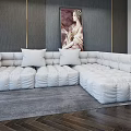 White Plush Sectional Sofa With Multiple Cushions Gray Wall Artwork And Dark Wood Flooring