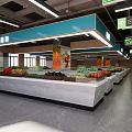 Supermarket Fresh Produce Aisle With Display Shelves Hanging Signage And Overhead Lighting
