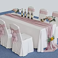 Elegant Banquet Table Setup With White Tablecloth Pink Chair Sashes Wine Bottles And Flower Bouquets