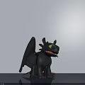 Black Dragon Doll with Wings and Yellow Eyes Standing on Gray Surface