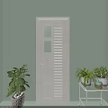 White Hinged Door With Glass Panels Louvered Design Against Light Green Wall And Green Plants