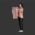 Woman Holding Pink Towel Wearing Pink Top Black Pants And White Shoes Against Gray Background