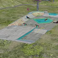 Outdoor Skate Park With Concrete Ramps Blue Areas Grass Trees And Railings