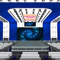 Modern Stage Design Featuring Blue Neon Lights Audience Seats Floral Backdrop And Central Logo