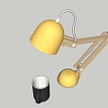 Stylish Table Lamp with Yellow Lampshade and Wooden Arm Alongside Black Mug