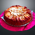 Round Cake Topped With Sliced Pears On Pink Patterned Cloth