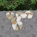 Modern Outdoor Chairs With Curved Design On Gray Stone Floor And Lush Greenery Backdrop
