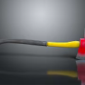Axe With Red Head And Yellow Gray Handle On Gray Background With Reflection