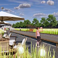 Rural Landscape With Outdoor Seating Area Walking Path People And Cyclist Under Blue Sky