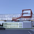 Modern School Building Design Featuring Glass Facade Red Staircase Pillars And Green Parking Lot