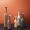 Modern Ceramic Vases In Various Colors With Orange Background And Different Heights