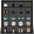 Assorted Tea Wares Display On Shelves With Teapots Cups And Tea Cakes