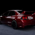 Modified Red Sedan With Black Rims And Racing Style Design