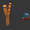 Colorful Handheld Slingshot With Orange Y Frame Black Elastic Bands Blue Projectile And Red Grip