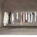 Stylish Minimalist Clothes Hanging on Wall in Modern Interior with Arch and Various Colors