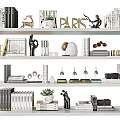 Modern Decorative Ornament Collection On White Shelves With Books Sculptures And Plants