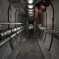Industrial Tunnel Interior With Large Metal Pipes Brick Walls And Railings