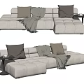 Light Beige Sectional Sofa with Brown Beige Pillows and Gray Throw Blanket 3d model