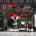 ELLE Jouet Exhibition Booth With Neon Signs Red Black Design And Large Gear Decoration