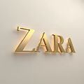 Golden ZARA Sign Wall Decor Mounted on White Wall with Modern Lighting