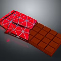 Red Wrapped Chocolate Bar With Square Brown Pieces And Smooth Glossy Surface