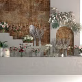Display Shelf Showcasing Various Flower Bouquets and Decorative Vases Against Textured Wall