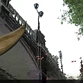 Aerial Planning of Urban Bridge With Street Lamp Water Reflection and Trees