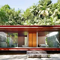 Contemporary Detached Villa With Stone Walls Large Glass Windows And Wooden Steps In Lush Forest