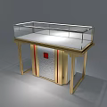 Specialty Store Display Cabinet Featuring Gold Frame Transparent Glass White Countertop And Red Accent