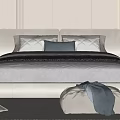 Cozy Modern Double Bed With Upholstered Headboard Pillows Ottoman And Soft Bedding
