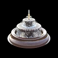 Elegant Multi Tiered Garden Fountain With Flowing Water And Round Stone Base