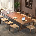 Wooden Conference Table With Laptops Documents And Chairs Near Window Plant