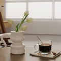 White Vase With Fresh White Tulips And Coffee Cup On Wooden Table By Window