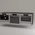Three Stainless Steel Kitchen Appliances Wall Mounted Side by Side With Digital Controls