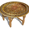 Round Decorative Dining Table With Intricate Patterns Gold Trim And Wooden Legs