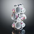 Decorative White Ceramic Mugs With Floral Patterns On Multi Tiered Metal Display Rack