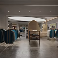 Spacious Modern Clothing Store Interior With Clothing Racks Mannequins And Natural Light