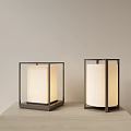 Two Modern Table Lamps With Square Metal Frame And White Fabric Shade Illuminated On Table