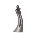 Black Abstract Sculpture of Embracing Figures as Modern Decorative Art Piece