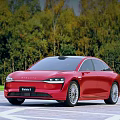 Red Seres 9 Sedan Parked In Outdoor Open Area With Lush Forest Backdrop