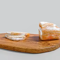 Whole and Sliced Bread with Powdered Surface on Wooden Board 3d model