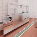 Commercial Kitchen With Stainless Steel Equipment Tiled Walls And Drainage Grates