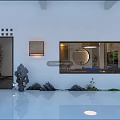 Modern Garden Space With White Walls Wooden Door Decorative Painting Circular Mirror Stones And Water