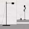 Modern Floor Lamp With Warm Light Projection And Small Plant In Glass Vase