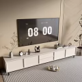 Modern White TV Stand with TV Decorations Clock and Plants in Living Room Interior