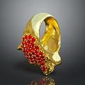 Elegant Golden Bracelet With Intricate Red Bead Decorations And Handcrafted Design