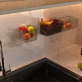 Modern Kitchen Interior Design With Marble Countertop Hanging Glasses Sink Fruits And Candles