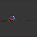 Red White Blue Sports Equipment Ball With Star And Moon Patterns On Sandy Ground