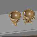 Gold Decorative Urns With Carved Lion Heads And Ornate Patterns On Tabletop