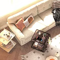 Large Beige Sectional Sofa In Bright Living Room With Orange Striped Cushions And Wheeled Cart